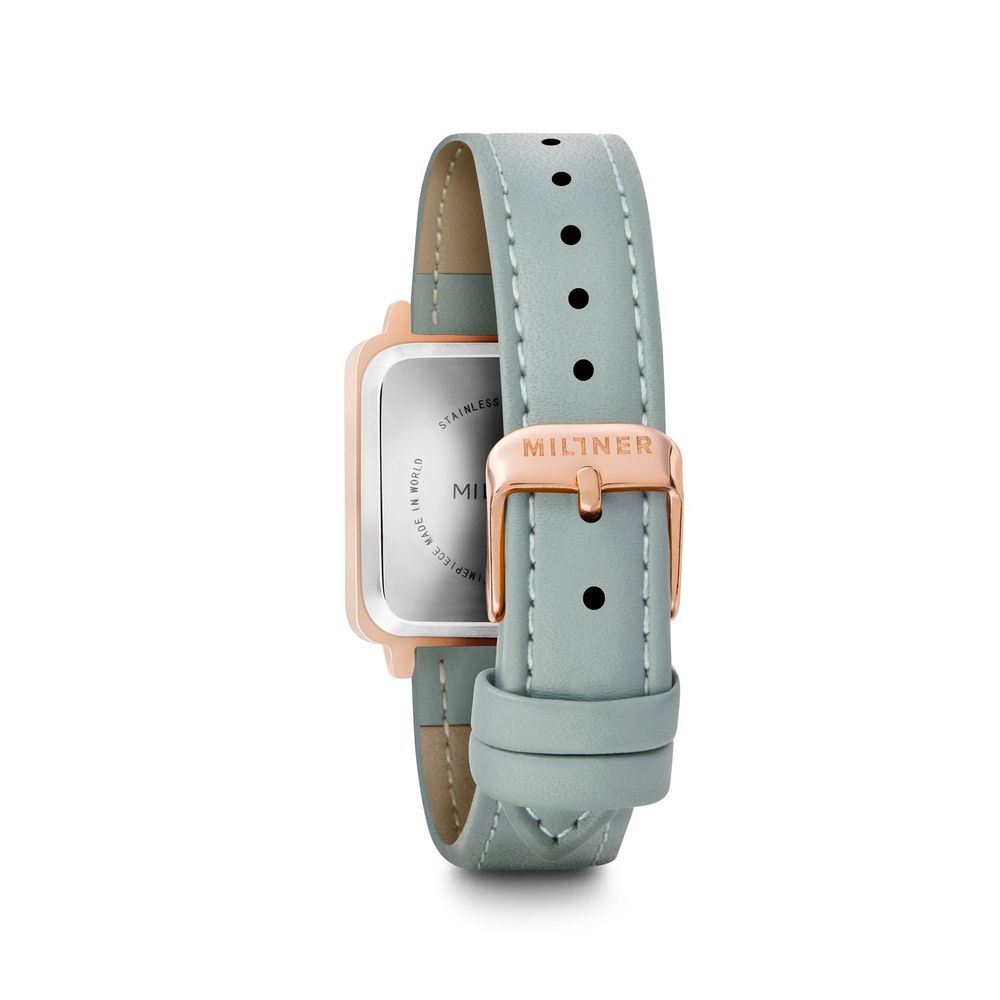 A blue leather watch with a pink face and silver accents, featuring the brand name "Millner" on the strap and face