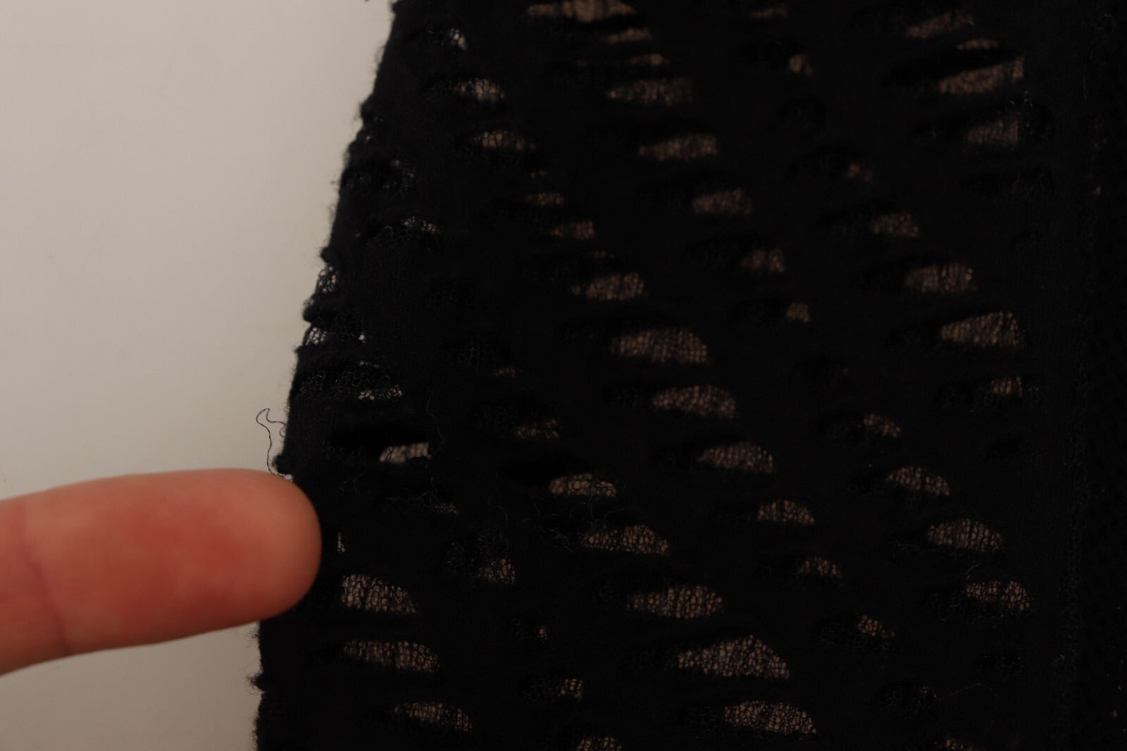 A black viscose bodycon sheath dress with long sleeves and a mini length