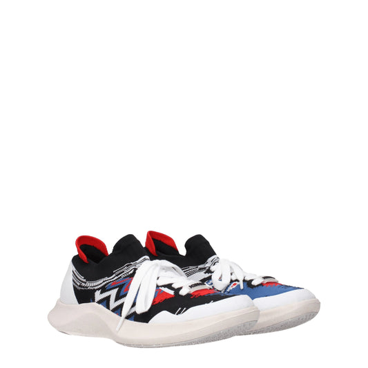 A pair of multicolored sneakers with a patterned design on the side, featuring laces and a flat sole