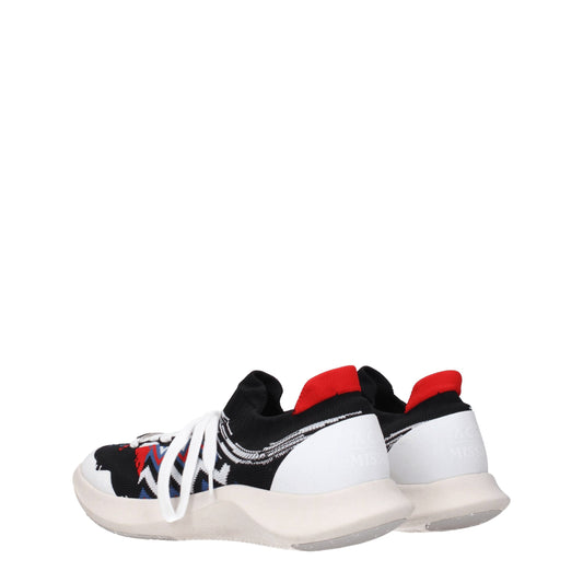 A pair of multicolored sneakers with a knit upper, featuring red, white, and black stripes on the side