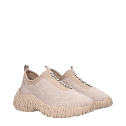 Tan suede slip on shoes with embellishments, featuring a chunky sole design