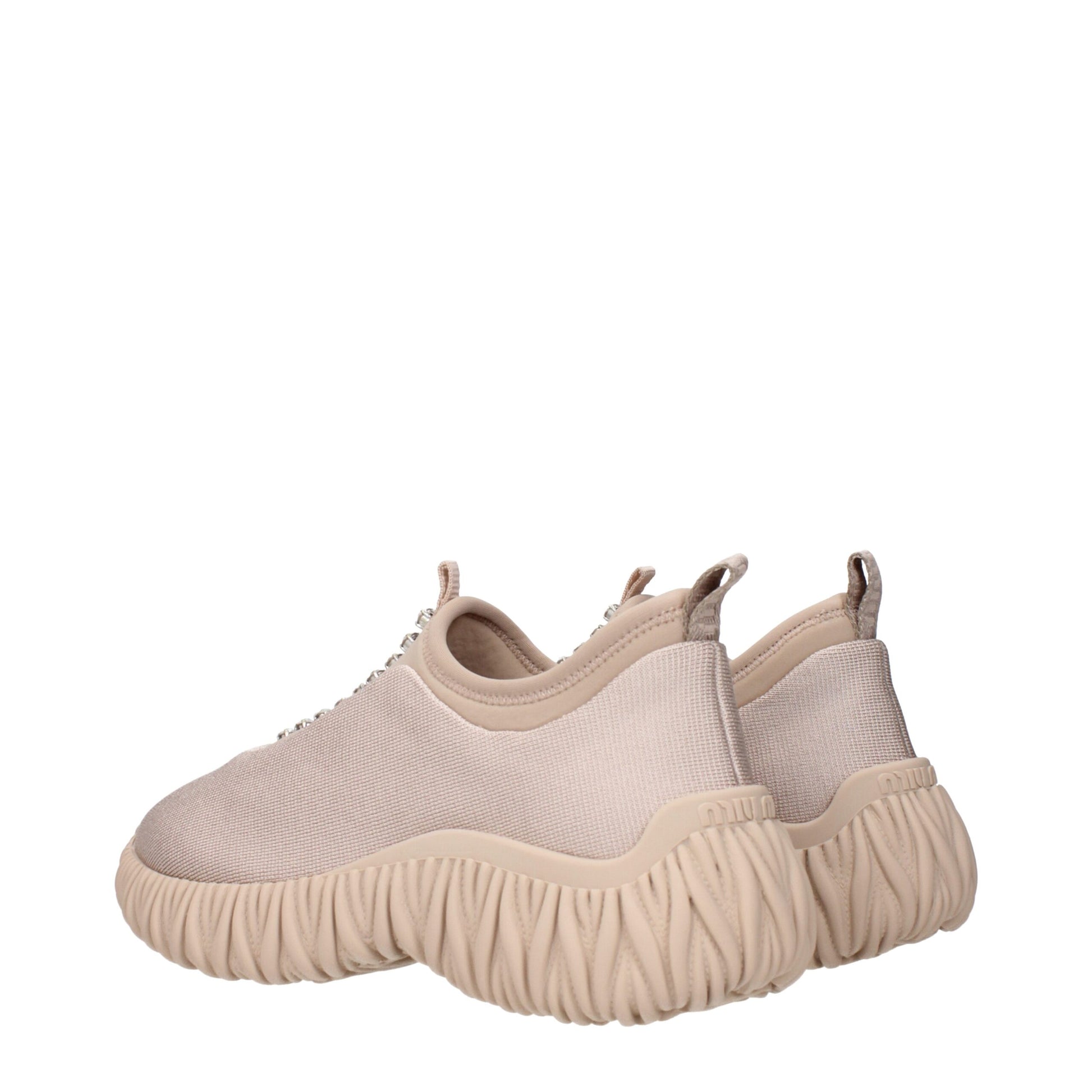 Tan suede slip on shoes with textured sole, featuring a chunky design and elastic panels for easy wear