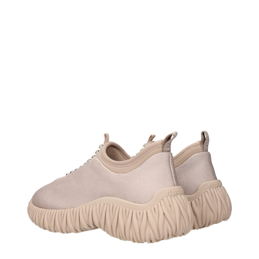 Tan suede slip on shoes with textured sole, featuring a chunky design and elastic panels for easy wear
