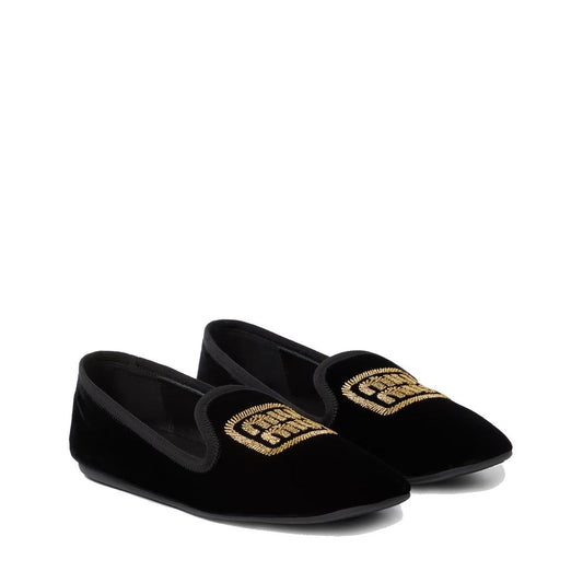 Pair of black velvet slippers with gold embroidery on soles