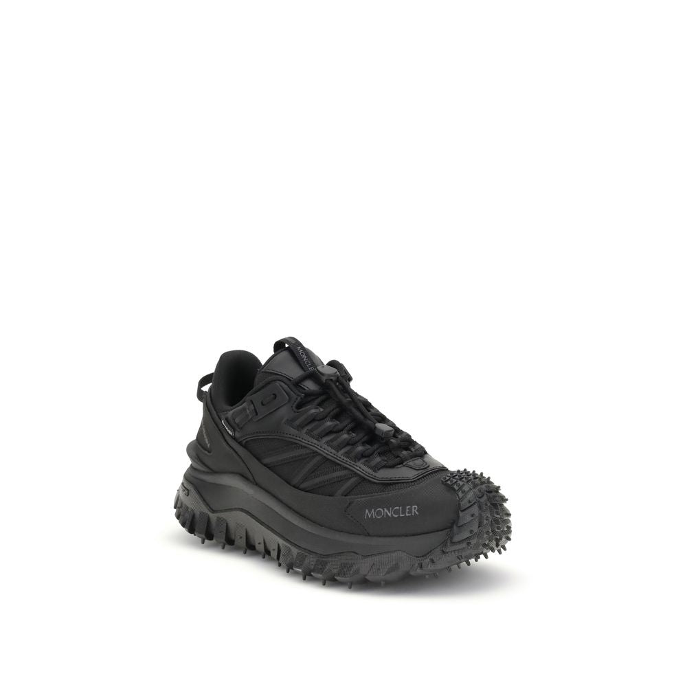 Black hiking shoe with spikes on sole