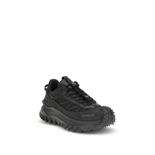 Black hiking shoe with spikes on sole