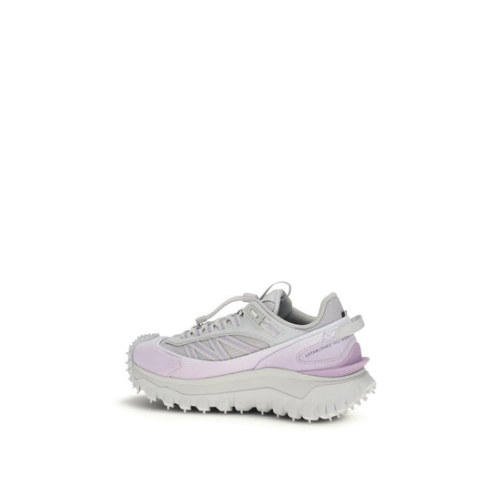 Pair of purple athletic sneakers with white laces, rubber sole and textured upper