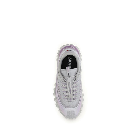 Pair of purple athletic sneakers with white laces, branded logo on side and sole