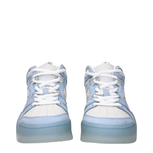 Pair of white leather high top sneakers with blue laces, featuring a chunky sole and a round toe design