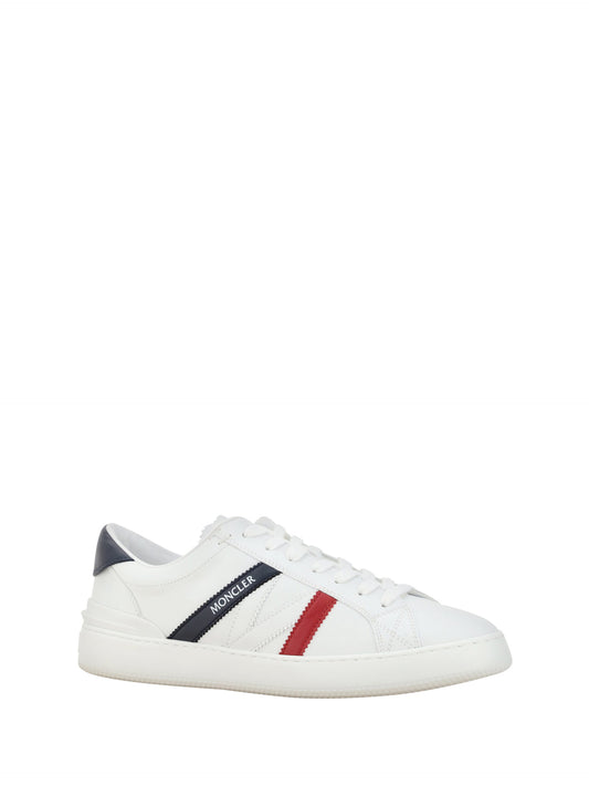 A pair of white sneakers with red stripes, featuring a low top design