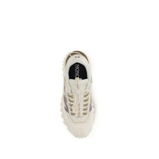 A pair of white athletic sneakers with a logo on the side, featuring laces and a rubber sole