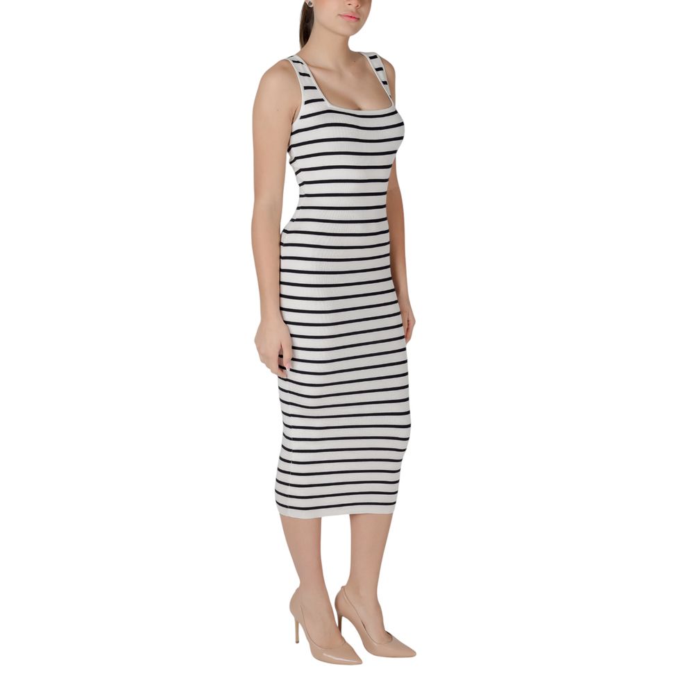A long sleeved black and white striped dress with a V-neckline