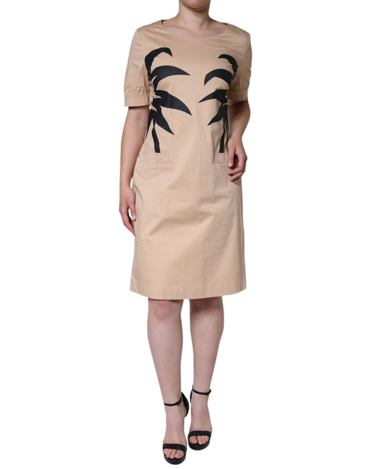 Tan dress with palm tree design on front