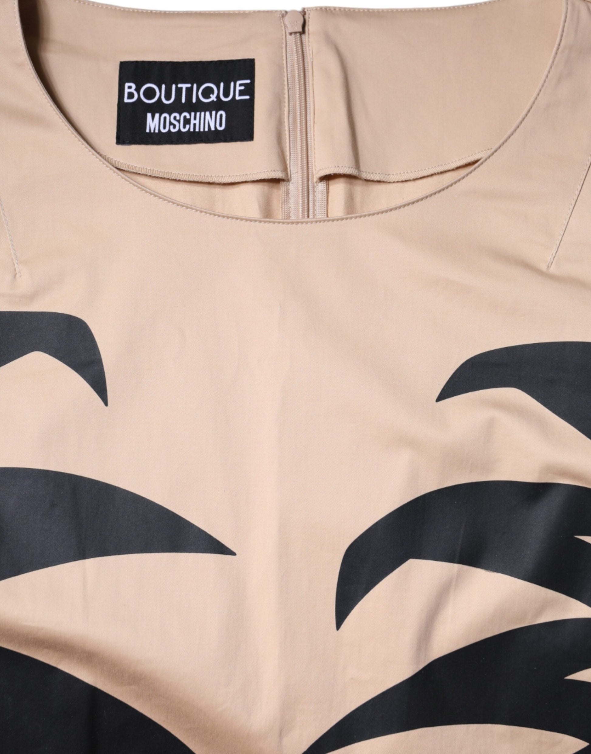 Tan shirt with black animal print design