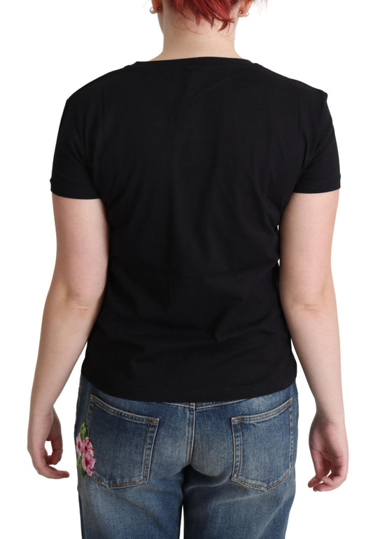 Black t-shirt on a person wearing jeans