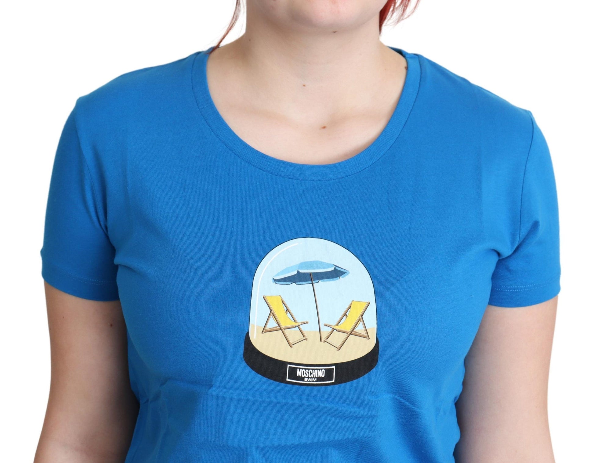 Blue t-shirt with graphic design of beach chairs on a sandy shore