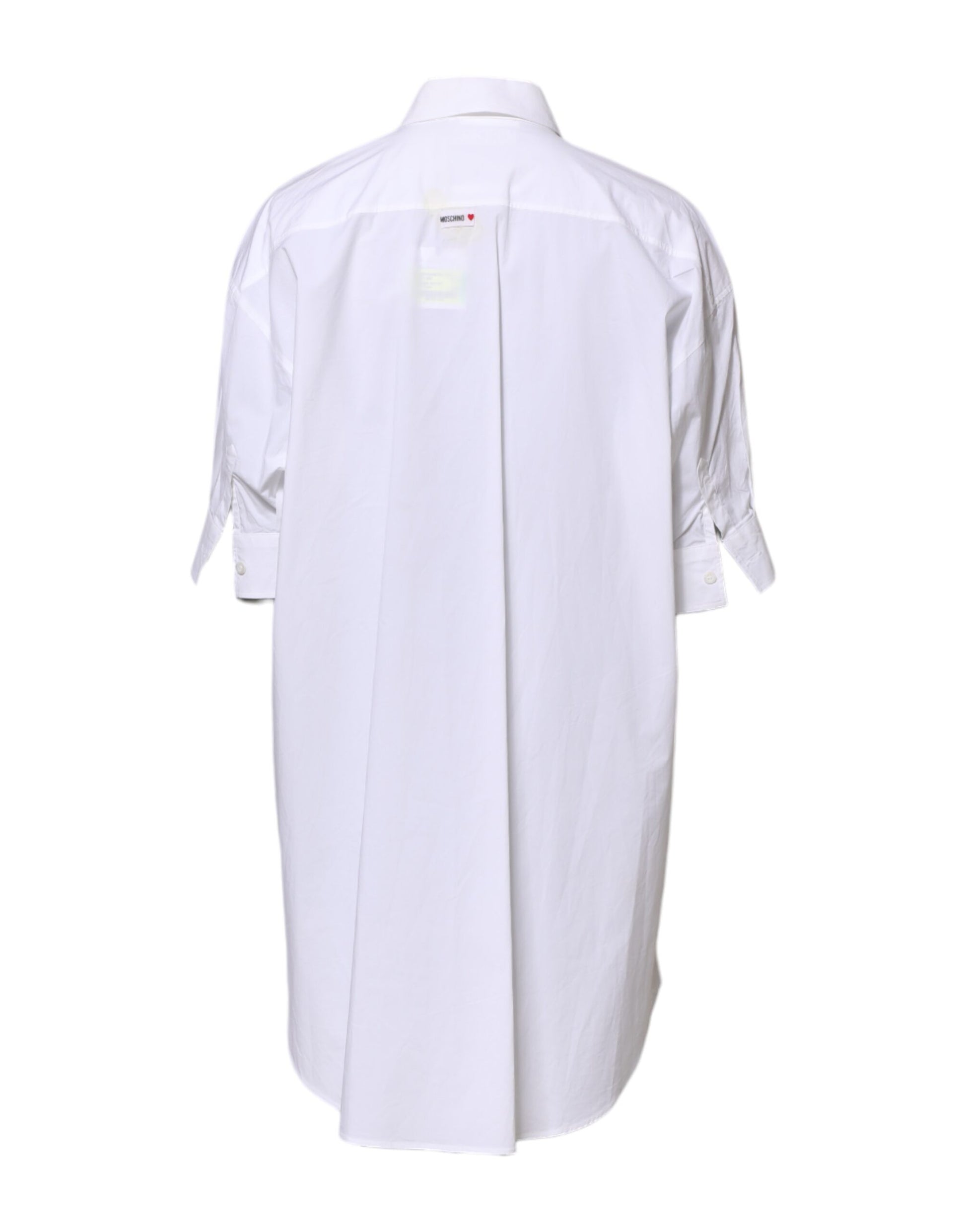 A white collared button mini shirt dress with a printed design
