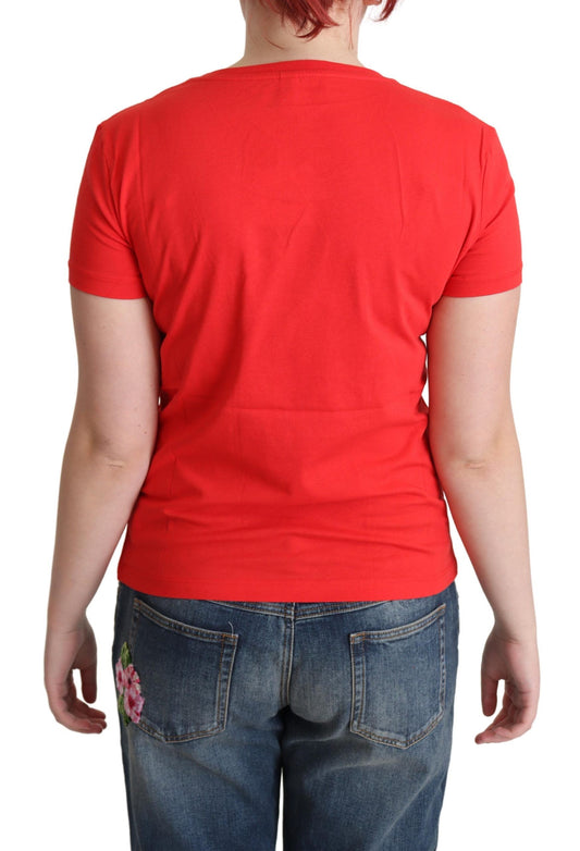 Red t-shirt on a person wearing blue jeans