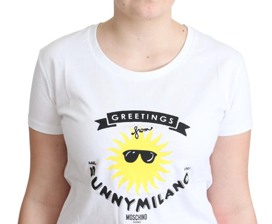 White t-shirt with graphic design featuring a sun wearing sunglasses and a banner that says "Greetings from Milan"