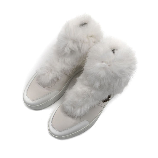 Pair of white furry slip-on shoes with cotton upper