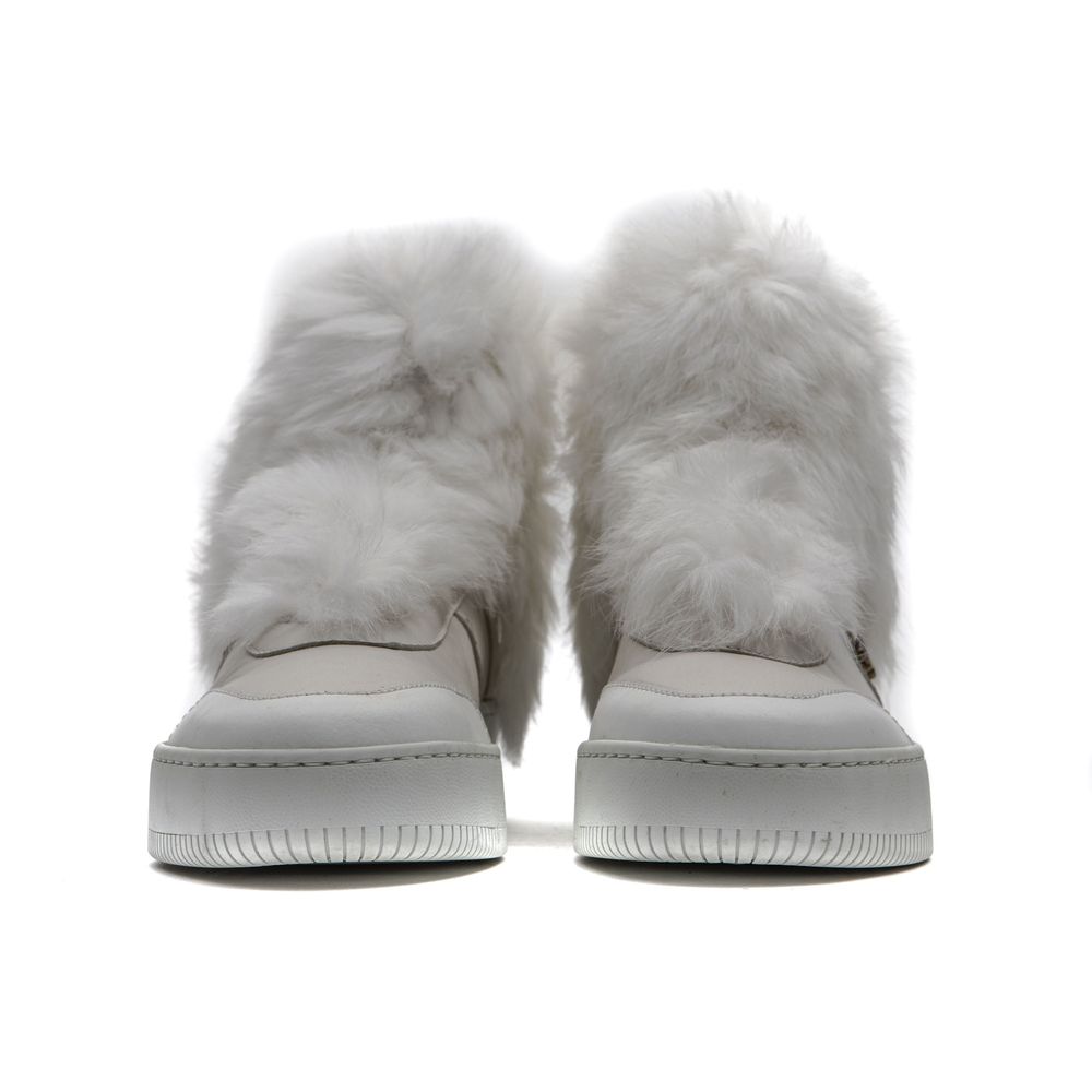 Pair of white furry slip-on shoes with a cotton base and a low platform sole