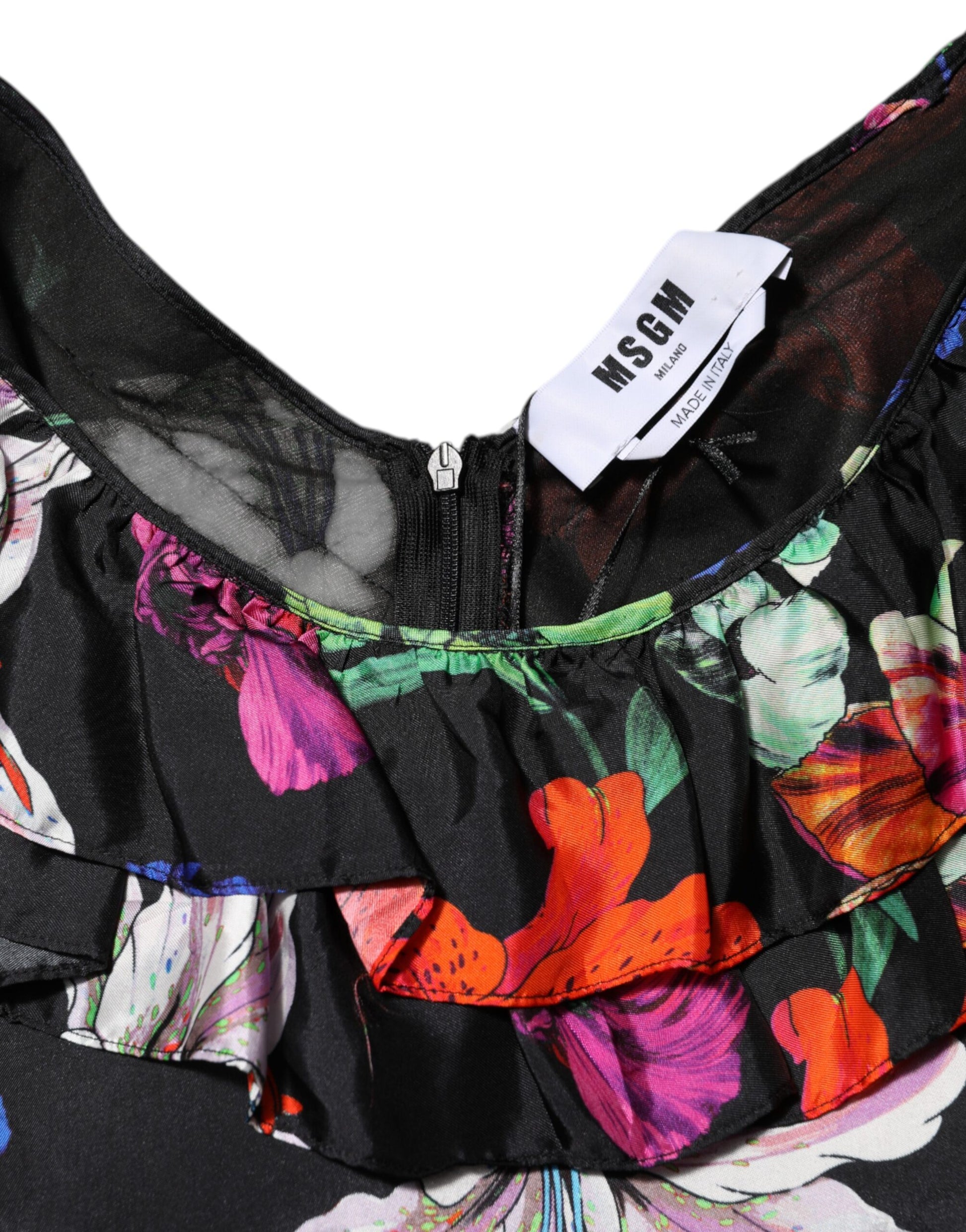 A black dress with a floral pattern and ruffled sleeves