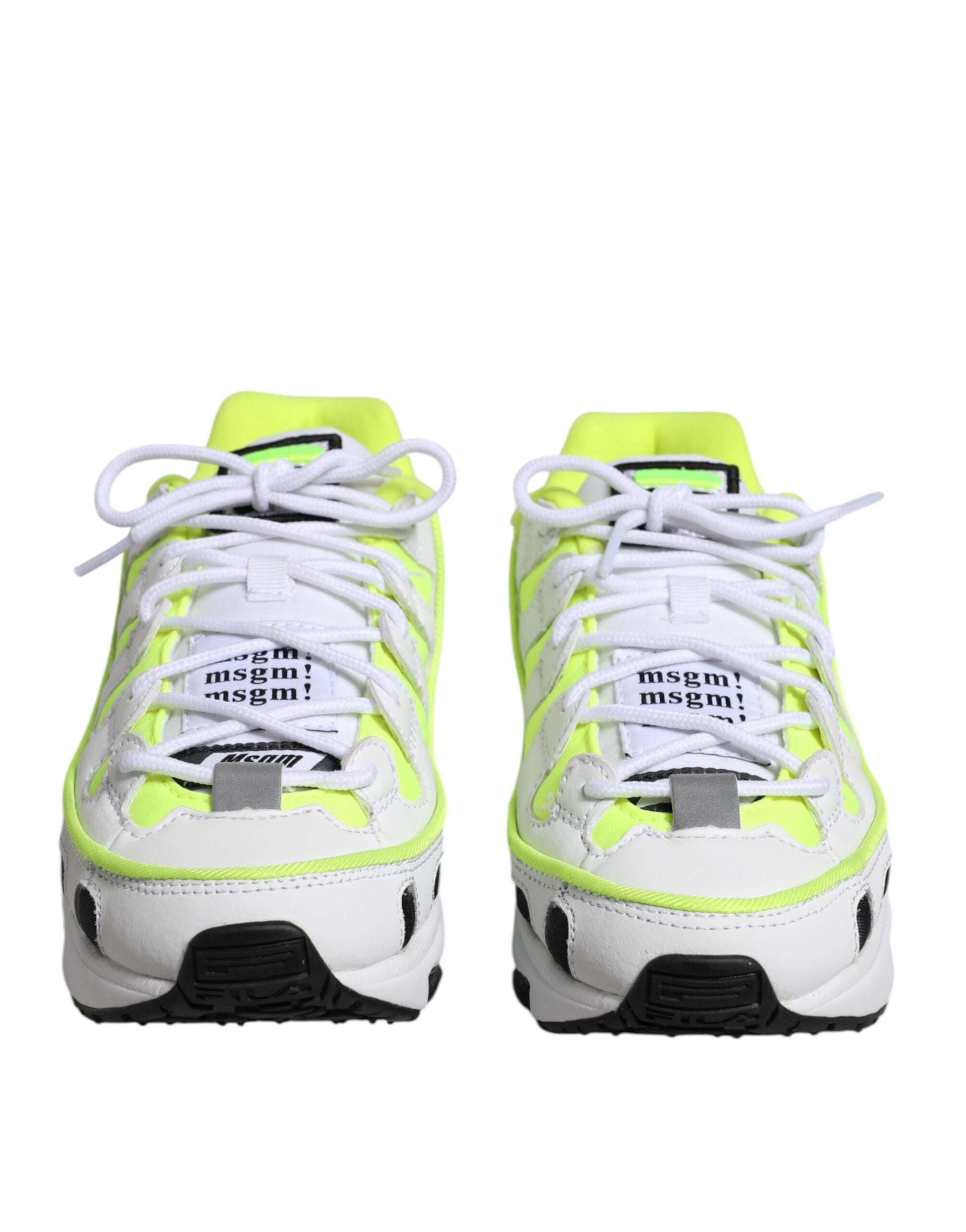 Pair of white and yellow sneakers with laces tied in a bow