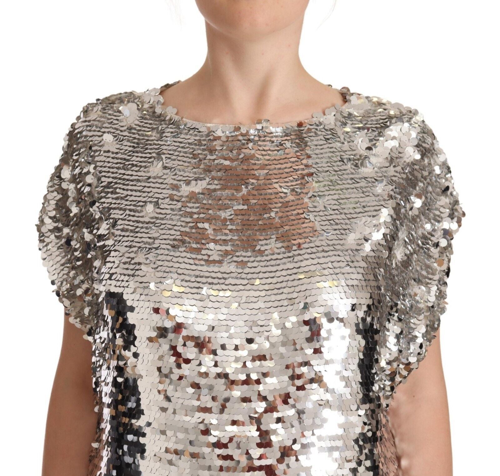 Silver sequined top on a person