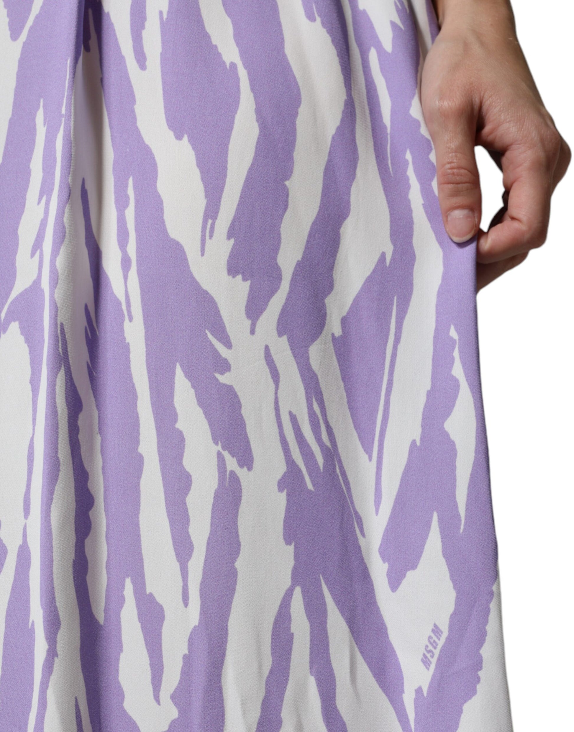 A woman's purple and white patterned maxi dress with short sleeves