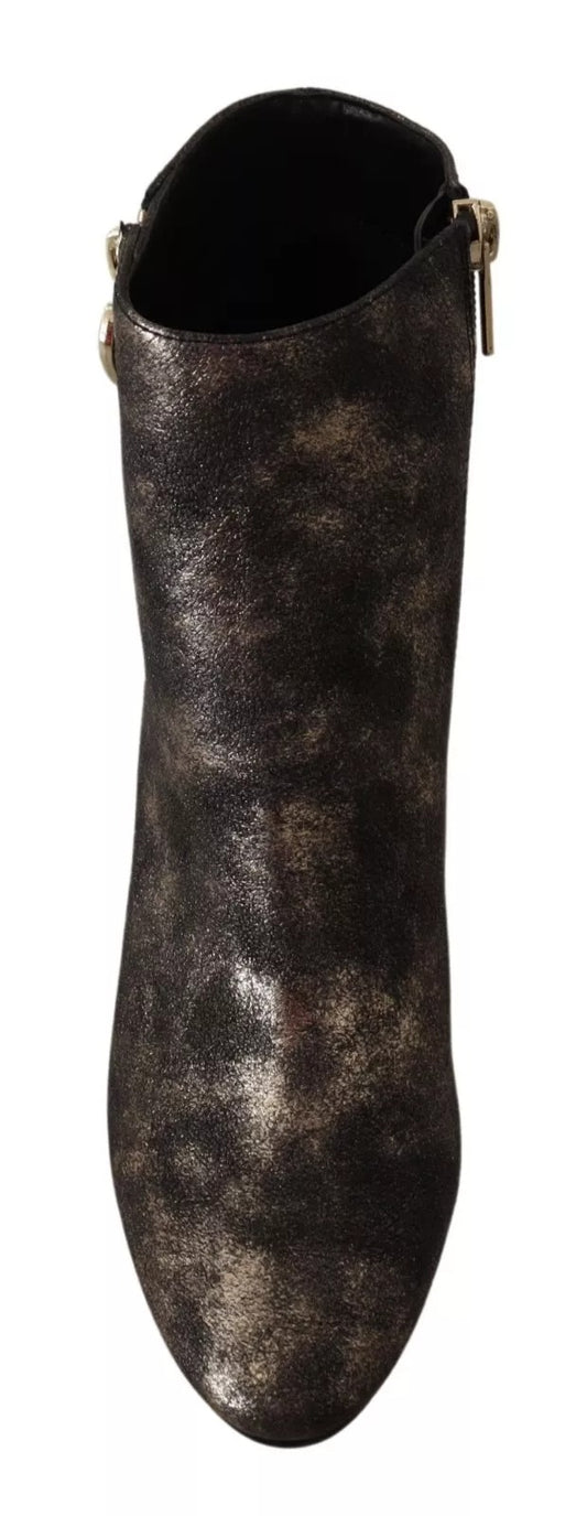 Tall black boot with glittery pattern on side