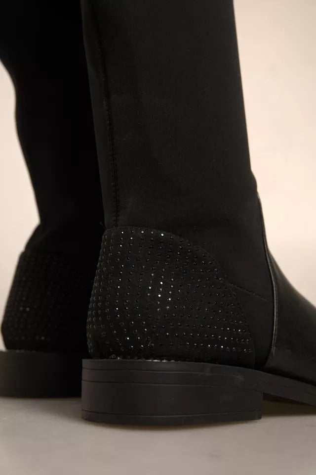 Black boot with silver studs on heel