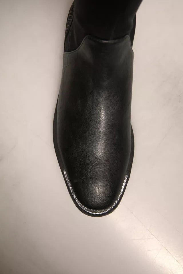 Black leather boot with white stitching