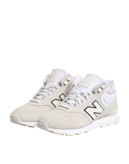 Pair of white sneakers with black logo on side
