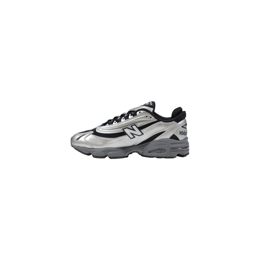 Silver and black athletic shoe with white sole