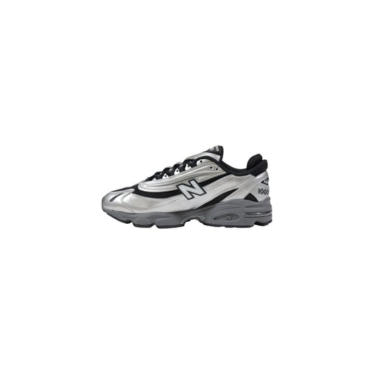 Silver and black athletic shoe with white sole