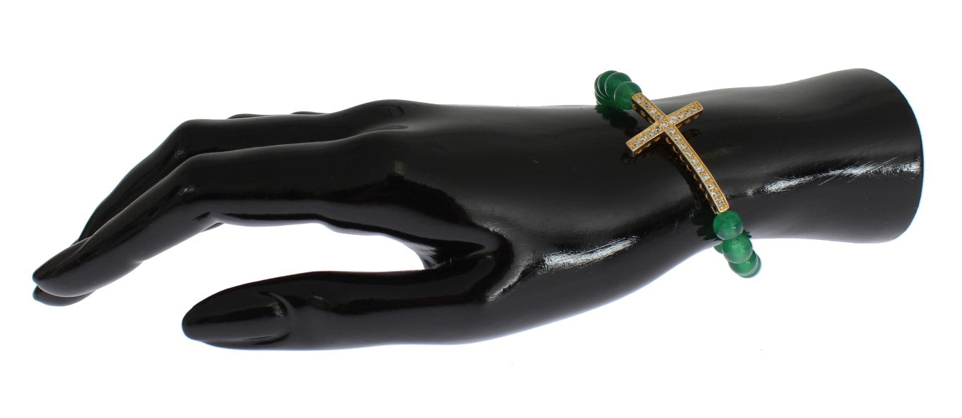 Green gemstone ring on black mannequin hand