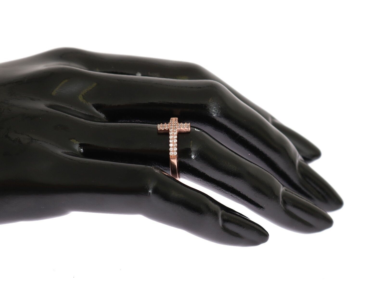 Hand wearing a cross ring