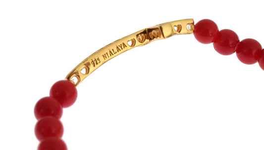 Gold bracelet with red beads