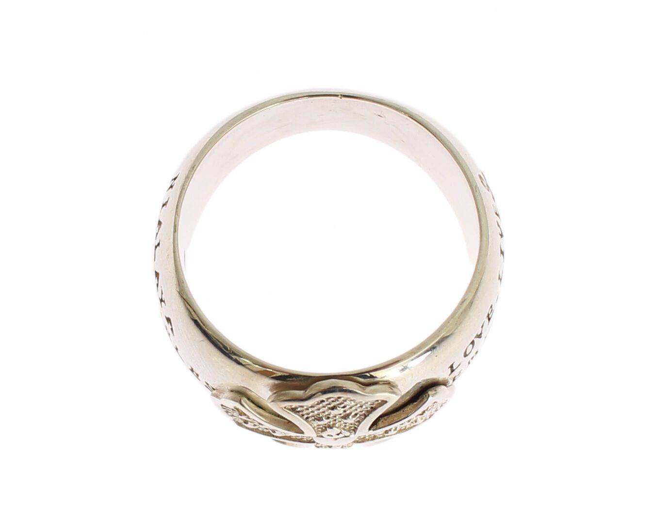 Gold ring with intricate design on top