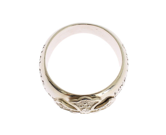 Gold ring with intricate design on top