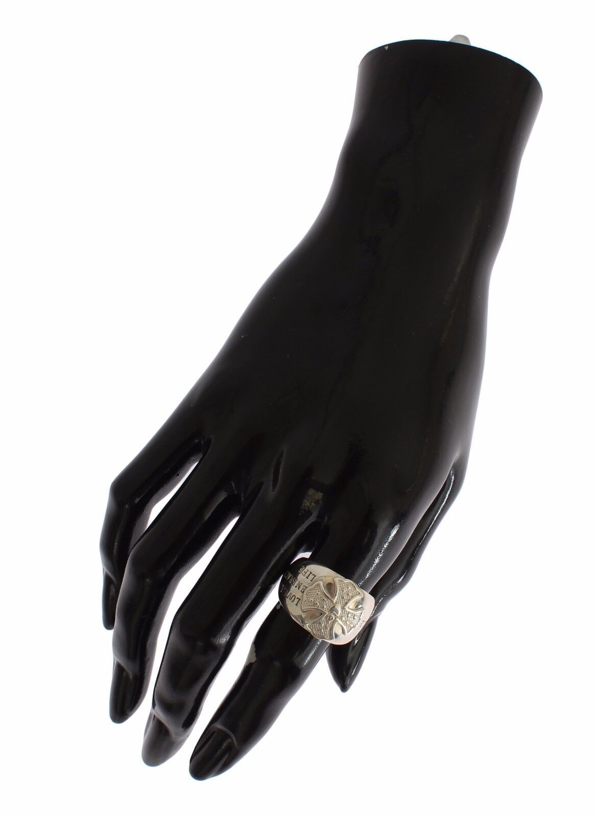 Hand wearing a ring on a black mannequin hand