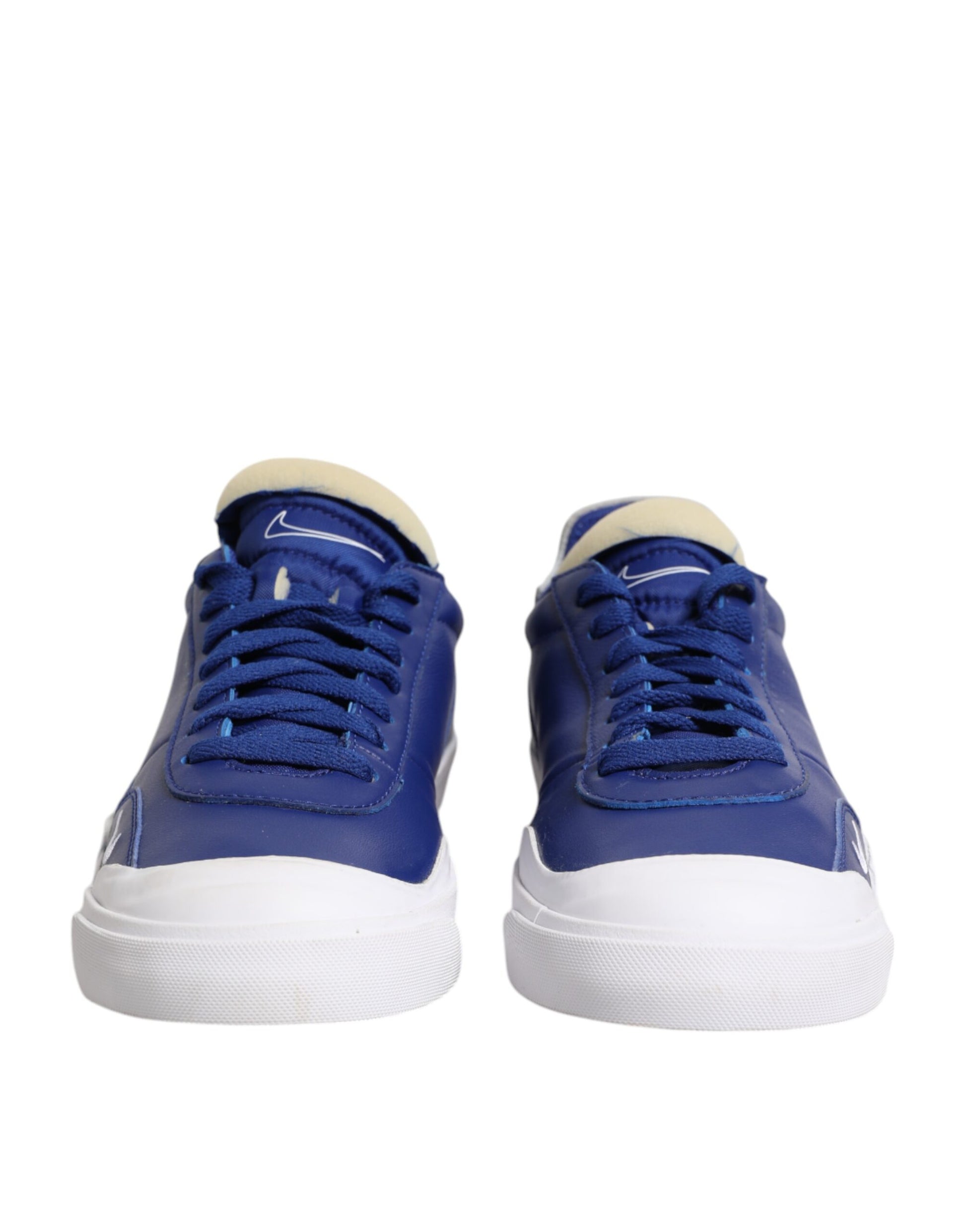 Blue sneakers with white soles