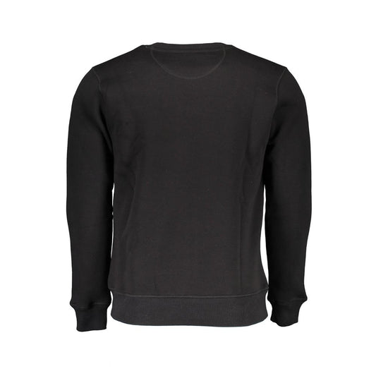 Black long sleeve sweater on hanger