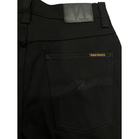 Black jeans with yellow label on back pocket