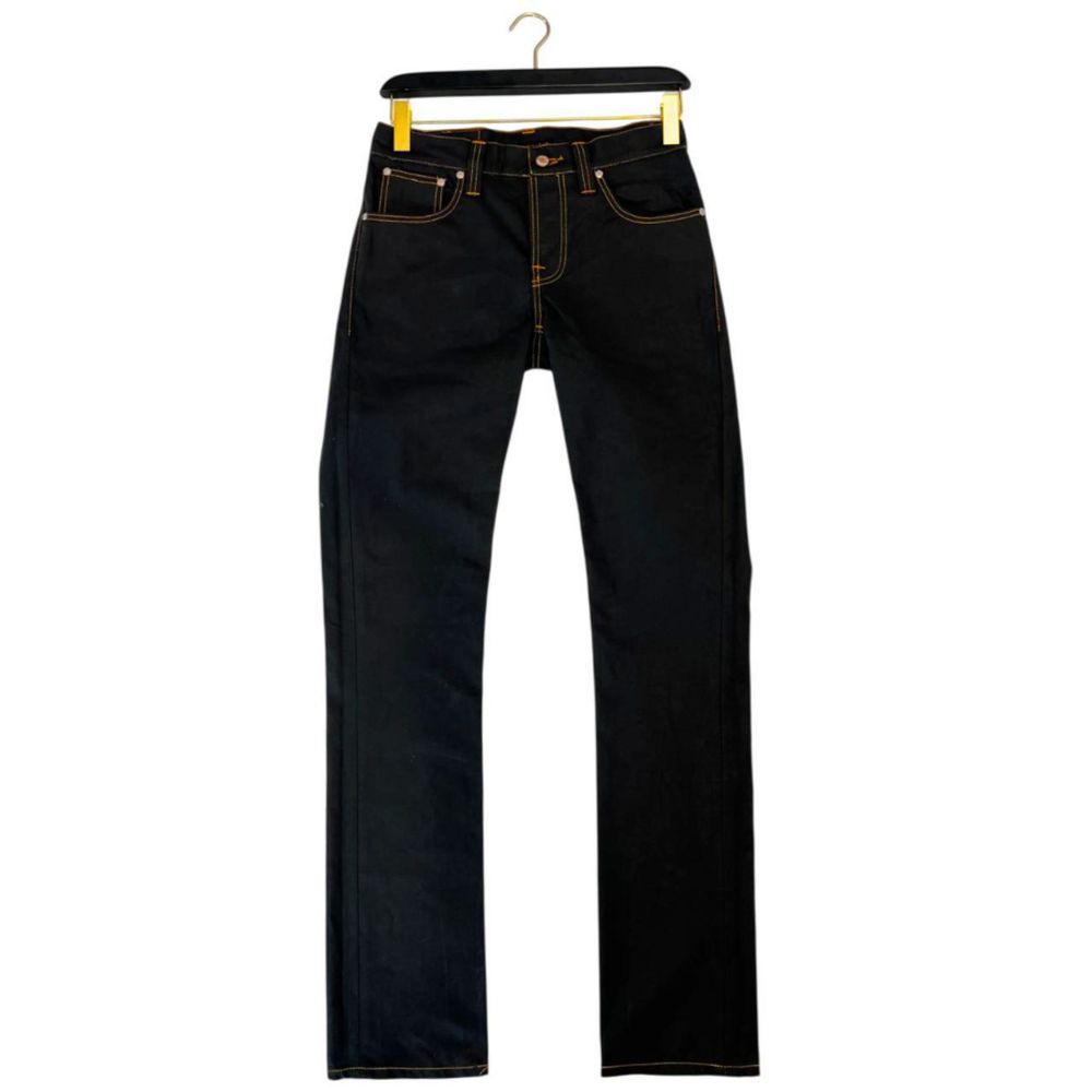 Pair of blue jeans hanging on a hanger