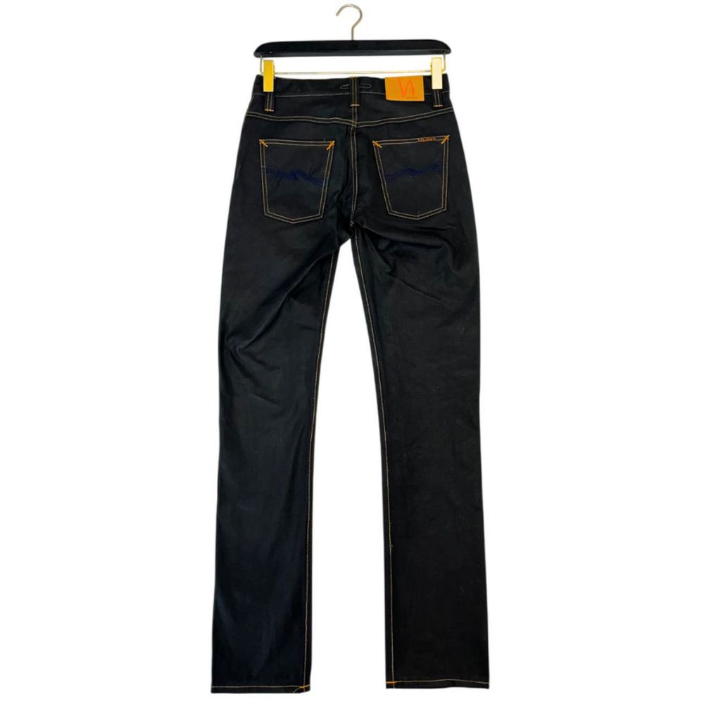 Pair of blue jeans hanging on a hanger