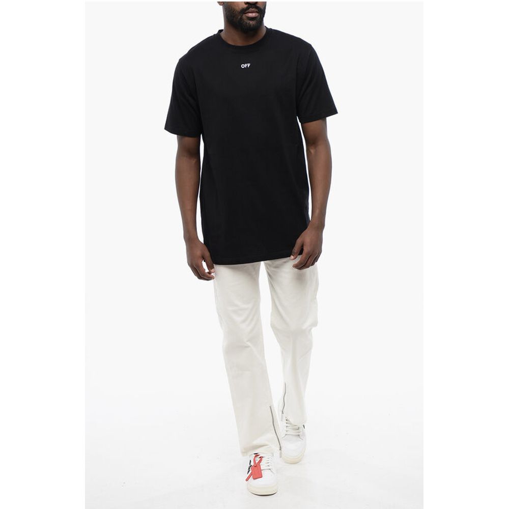 Man wearing black t-shirt and khaki pants