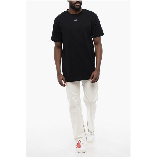 Man wearing black t-shirt and khaki pants