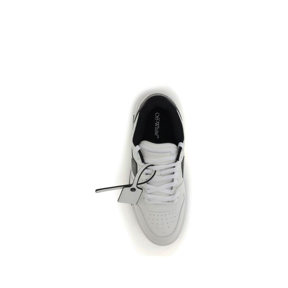 A pair of white sneakers with black laces and a black sole, featuring a tag attached to the shoe