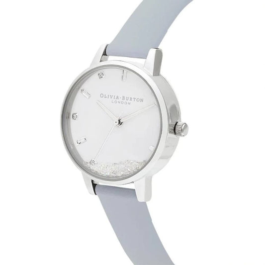 Silver watch with white face and blue strap, featuring a sparkling design on the dial